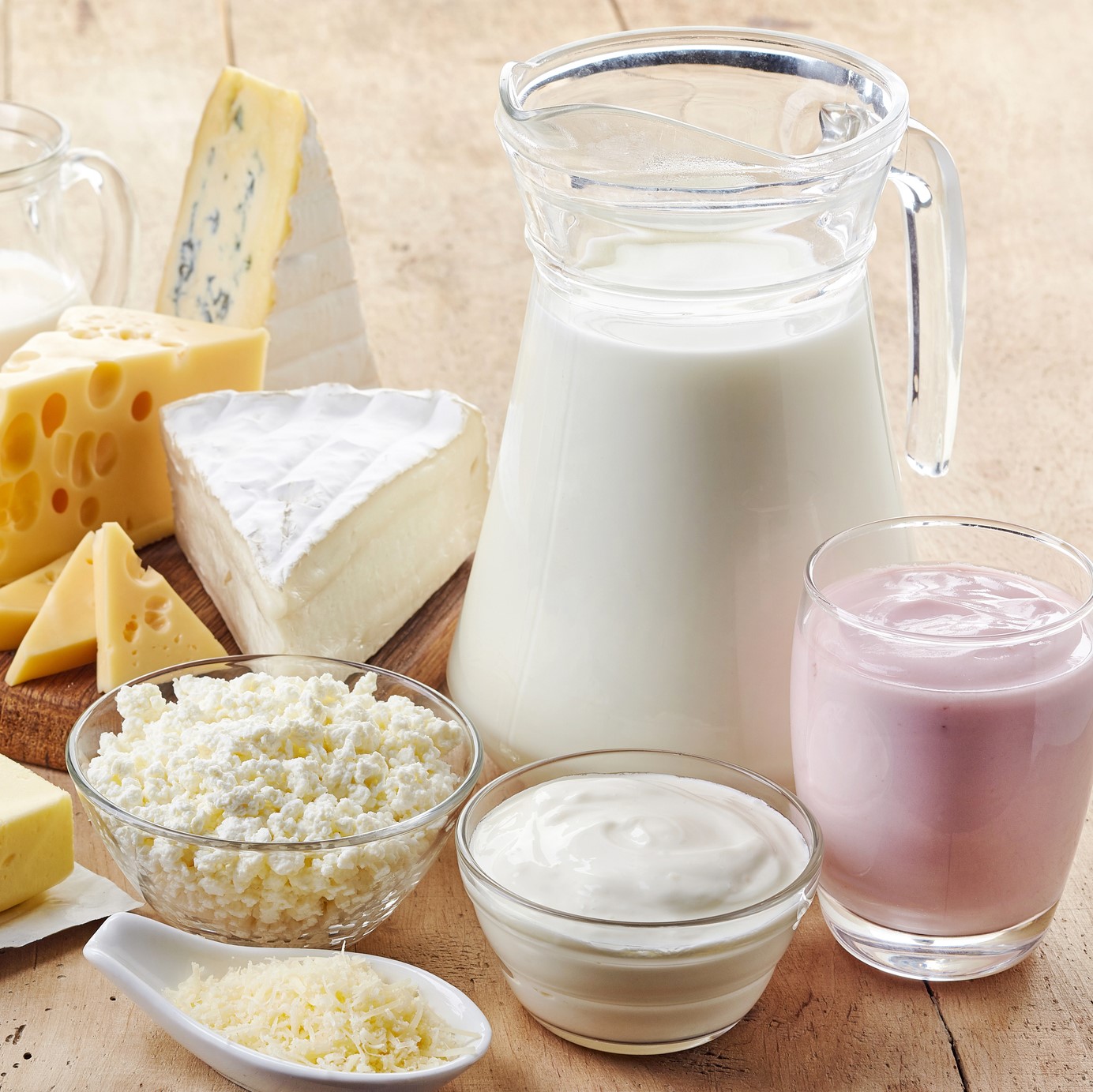 Various fresh dairy products on wooden background